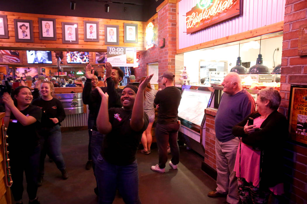 Staff members, including hostess Kemani Williams, dance at Texas Roadhouse at 1380 E. Craig Road in North Las Vegas Wednesday, Dec. 12, 2018. K.M. Cannon Las Vegas Review-Journal @KMCannonPhoto