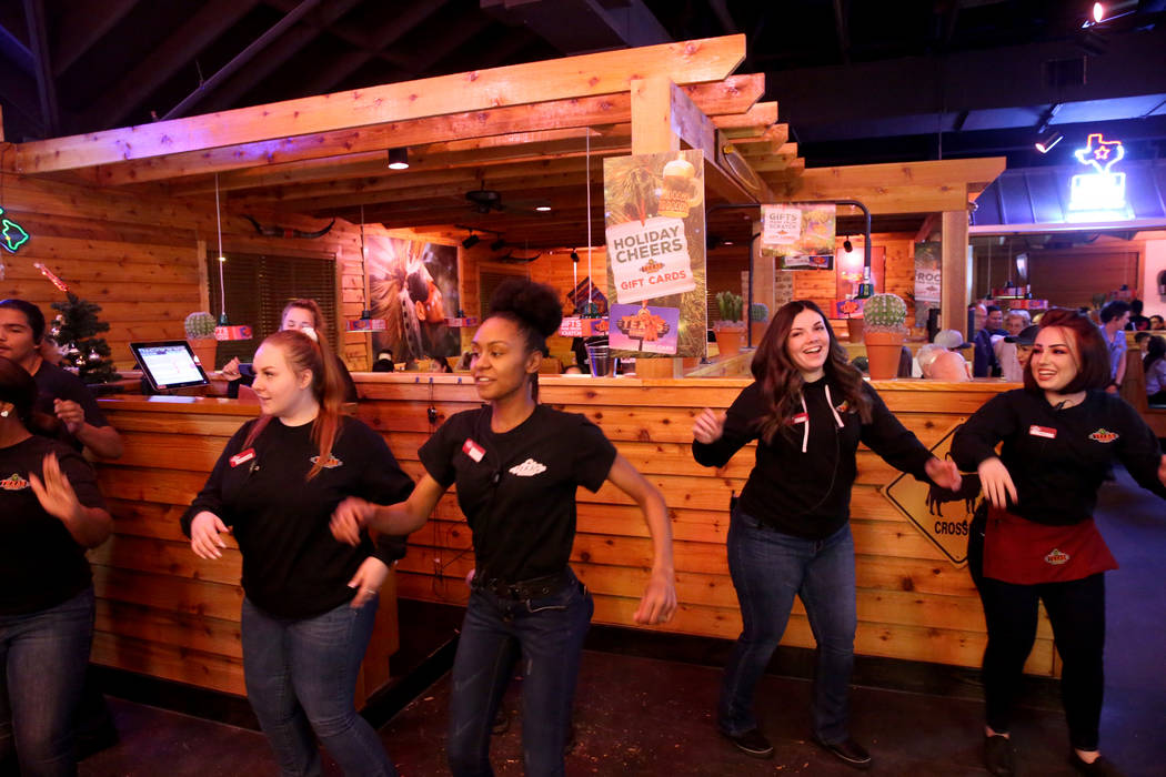 Staff members dance at Texas Roadhouse at 1380 E. Craig Road in North Las Vegas Wednesday, Dec. 12, 2018. K.M. Cannon Las Vegas Review-Journal @KMCannonPhoto