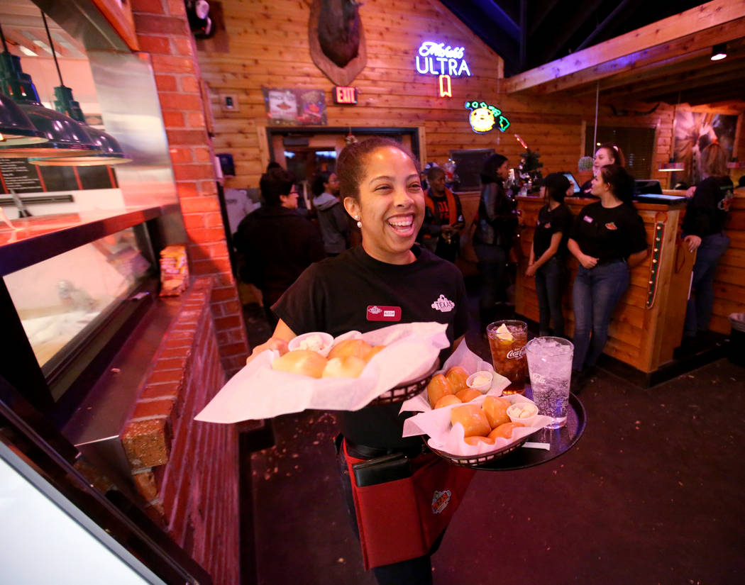 Alecia Grice delivers fresh baked bread and drinks at Texas Roadhouse at 1380 E. Craig Road in North Las Vegas Wednesday, Dec. 12, 2018. K.M. Cannon Las Vegas Review-Journal @KMCannonPhoto