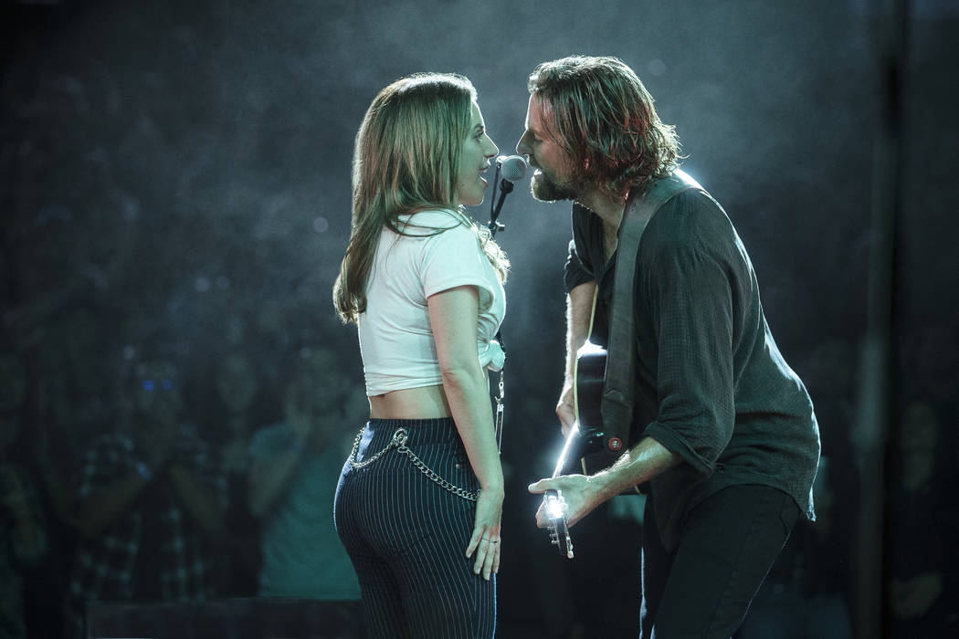 This image released by Warner Bros. Pictures shows Lady Gaga, left, and Bradley Cooper in a scene from "A Star is Born." (Clay Enos/Warner Bros. Pictures via AP)