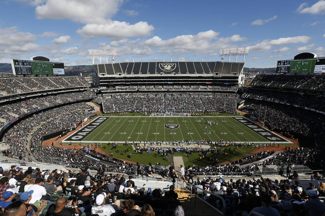 Fans at Oakland Alameda County Coliseum watch from a general view during the first half of an NFL football game between the Oakland Raiders and the Indianapolis Colts in Oakland, Calif., Sunday, O ...