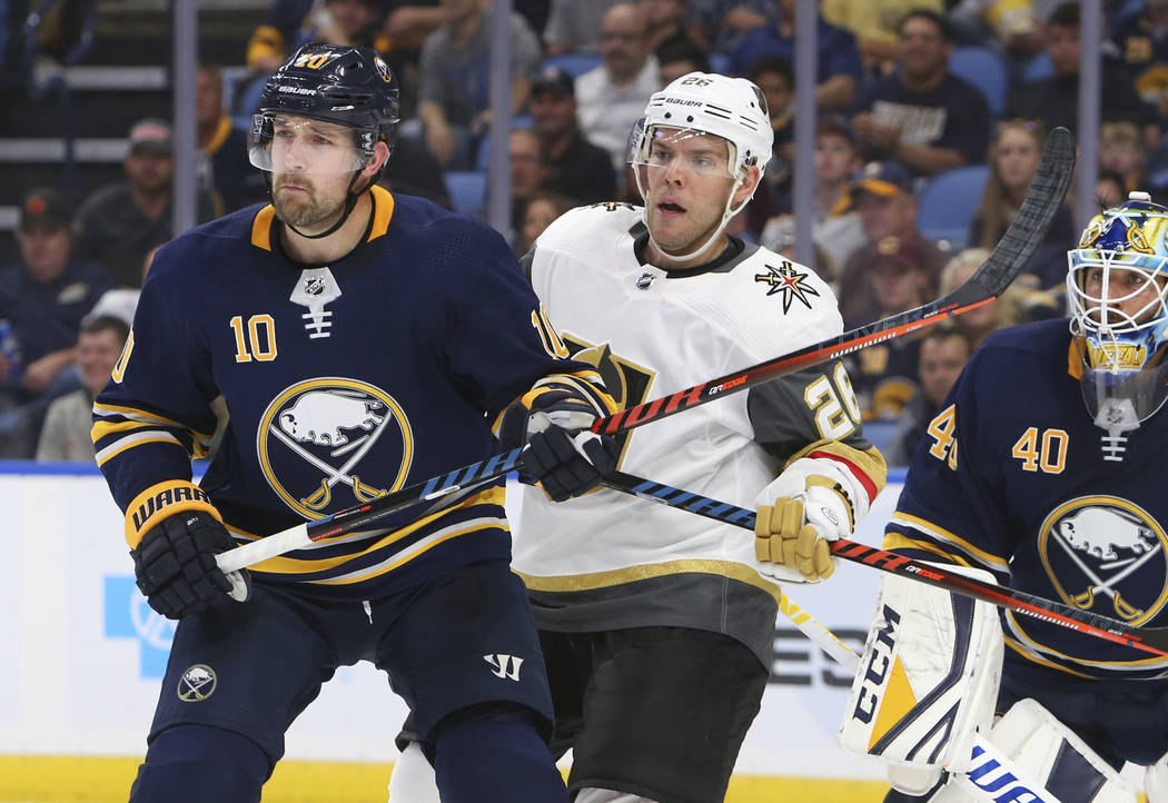 Buffalo Sabres forward Patrik Berglund (10) and Vegas Golden Knights forward Paul Stastny (26) battle in front of net during the second period of an NHL hockey game, Monday, Oct. 8, 2018, in Buffa ...
