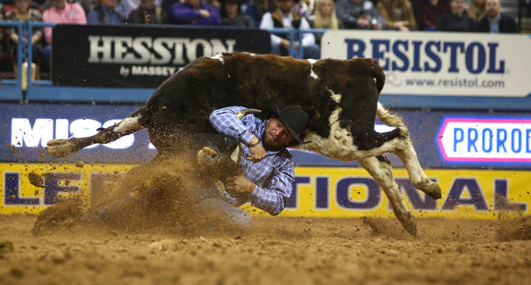 Jacob Talley of Keatchie, La. (66) competes in Steer Wrestling during the sixth go-round of the National Finals Rodeo at the Thomas & Mack Center in Las Vegas, Tuesday, Dec. 11, 2018. Caroline ...