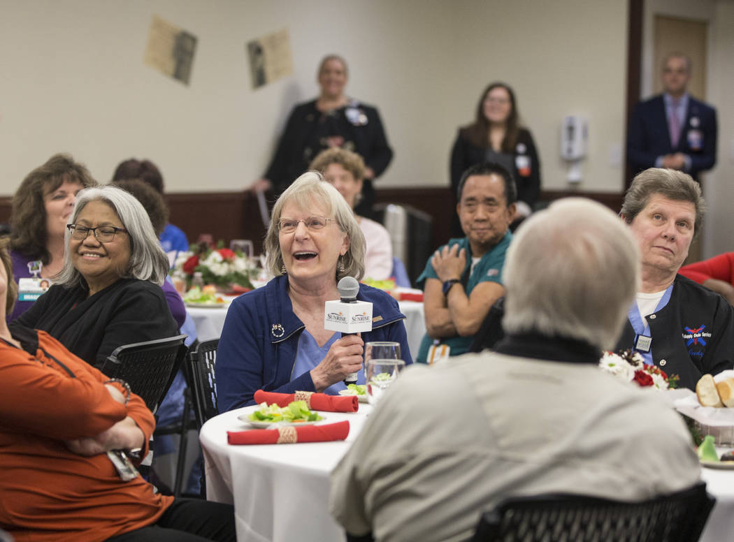 Mary McElhattan, middle, shares a laugh with attendees during a 60th anniversary luncheon for Sunrise Hospital and Medical Center on Wednesday, Dec. 12, 2018, in Las Vegas. Benjamin Hager Las Vega ...
