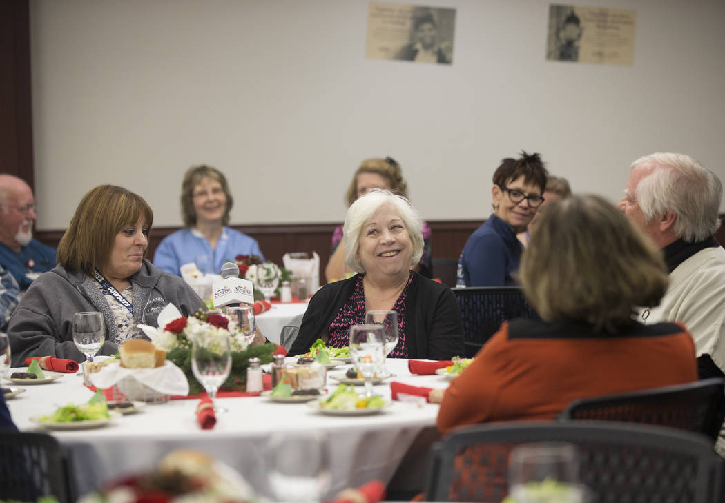 Leslie Mower, middle, shares a laugh with attendees during a 60th anniversary luncheon for Sunrise Hospital and Medical Center on Wednesday, Dec. 12, 2018, in Las Vegas. Benjamin Hager Las Vegas R ...