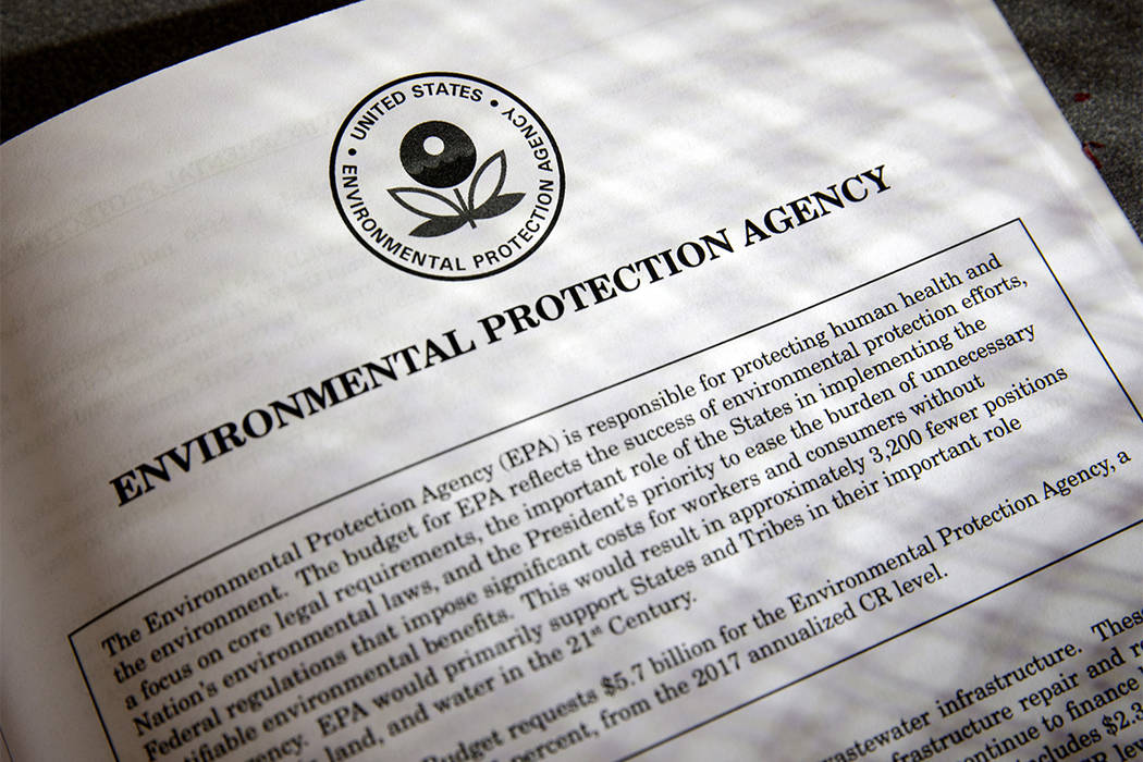 In this March 16, 2017, file photo, proposals for the Environmental Protection Agency in President Donald Trump's first budget are displayed at the Government Printing Office in Washington. (J. Sc ...