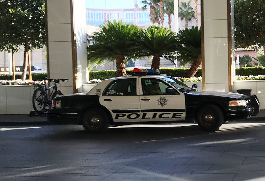 A police car is seen in front of Trump International hotel in Las Vegas, Wednesday, Dec. 12, 2018. A man washing windows outside the hotel fell to his death Wednesday afternoon. Chitose Suzuki Las ...