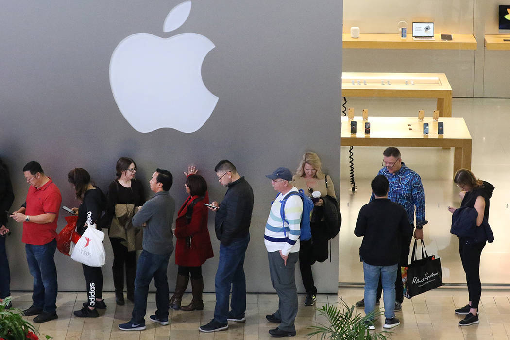 Black Friday sale shoppers stand in line at the Fashion Show Mall