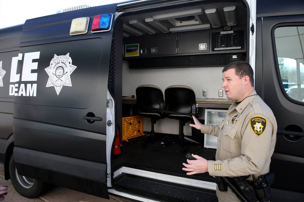 Metropolitan Police Department Traffic Officer Mike Thiele shows the van used for processing and transporting alleged impaired drivers by the Metro-Nevada Highway Patrol DUI Strike Team after a ne ...