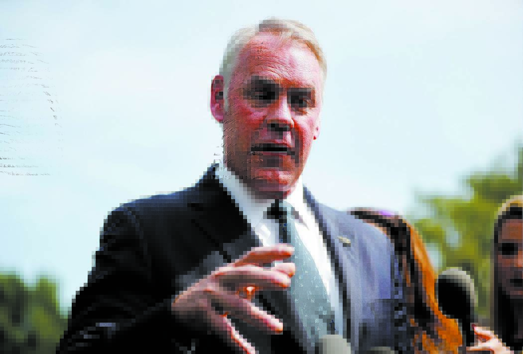 FILE--IIn this Aug. 16, 2018, file photo, Interior Secretary Ryan Zinke speaks to members of the media outside the White House in Washington, D.C. Zinke has scheduled a visit, Monday, Oct. 8 to Mo ...