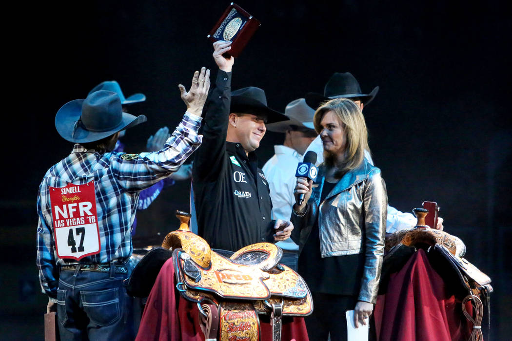 Trevor Brazile of Decatur, Texas (2) is honored on stage after becoming the 2018 PRCA All Around World Campion during the tenth go-round of the National Finals Rodeo at the Thomas & Mack Cente ...