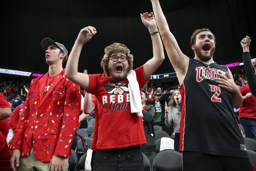 UNLV Rebels fans celebrate the game-winning shot by Rebels guard Noah Robotham (5) to defeat the Brigham Young Cougars 92-90 following an NCAA college basketball game at T-Mobile Arena in Las Vega ...