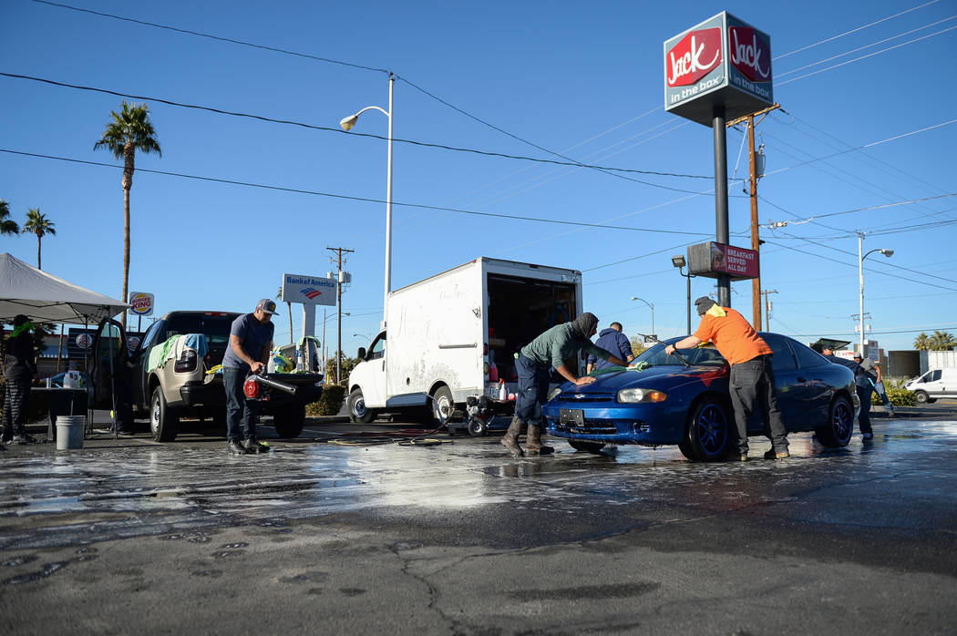 Friends of Jonathan Garcia, who died Wednesday after falling outside Trump hotel, hold a carwash fundraiser in Las Vegas, Sunday, Dec. 16, 2018. Caroline Brehman/Las Vegas Review-Journal