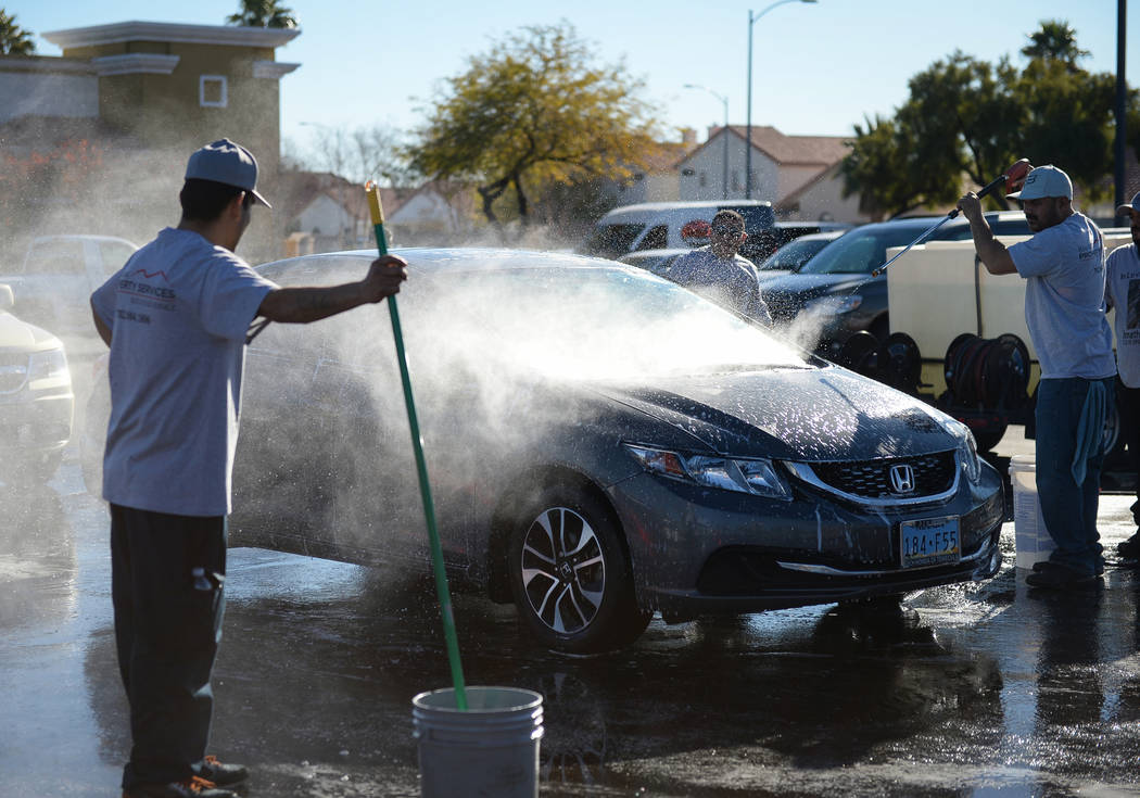 Friends of Jonathan Garcia, who died Wednesday after falling outside Trump hotel, hold a carwash fundraiser in Las Vegas, Sunday, Dec. 16, 2018. Caroline Brehman/Las Vegas Review-Journal