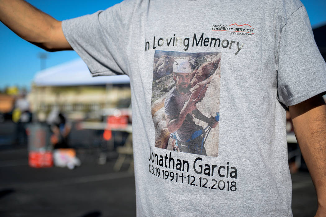 Friends of Jonathan Garcia, who died Wednesday after falling outside Trump hotel, hold a carwash fundraiser wearing t-shirts with his photograph to remember the life of their fallen friend in Las ...