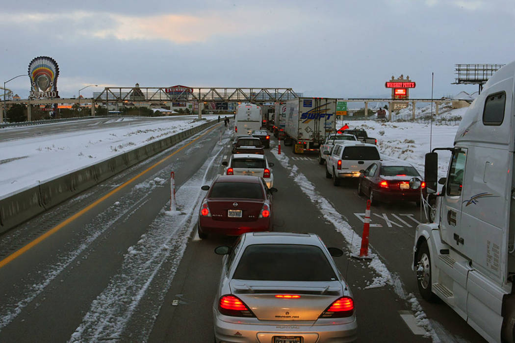 Vehicles line southbound Interstate 15 at Primm after the freeway was closed on Dec. 18, 2008, due to a snowstorm that blew through southern Nevada and parts of California. (Las Vegas Review-Journal)
