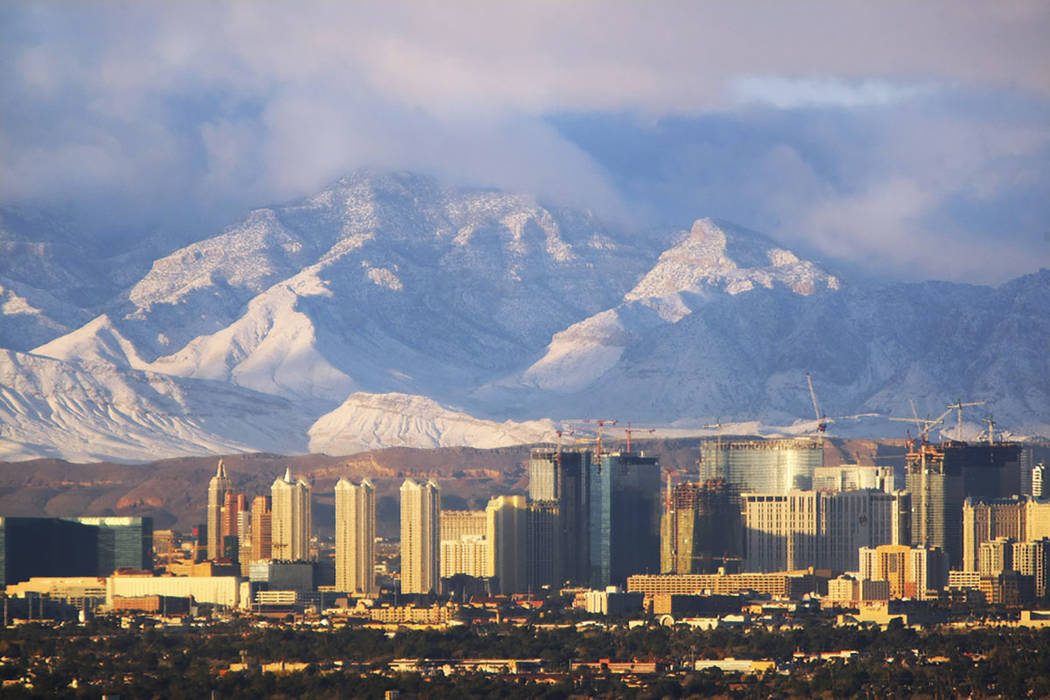 The morning sunlight gives a glow to the Las Vegas Strip and the snow-dusted Spring Mountains on Tuesday, Dec. 16, 2008. (Las Vegas Review-Journal)