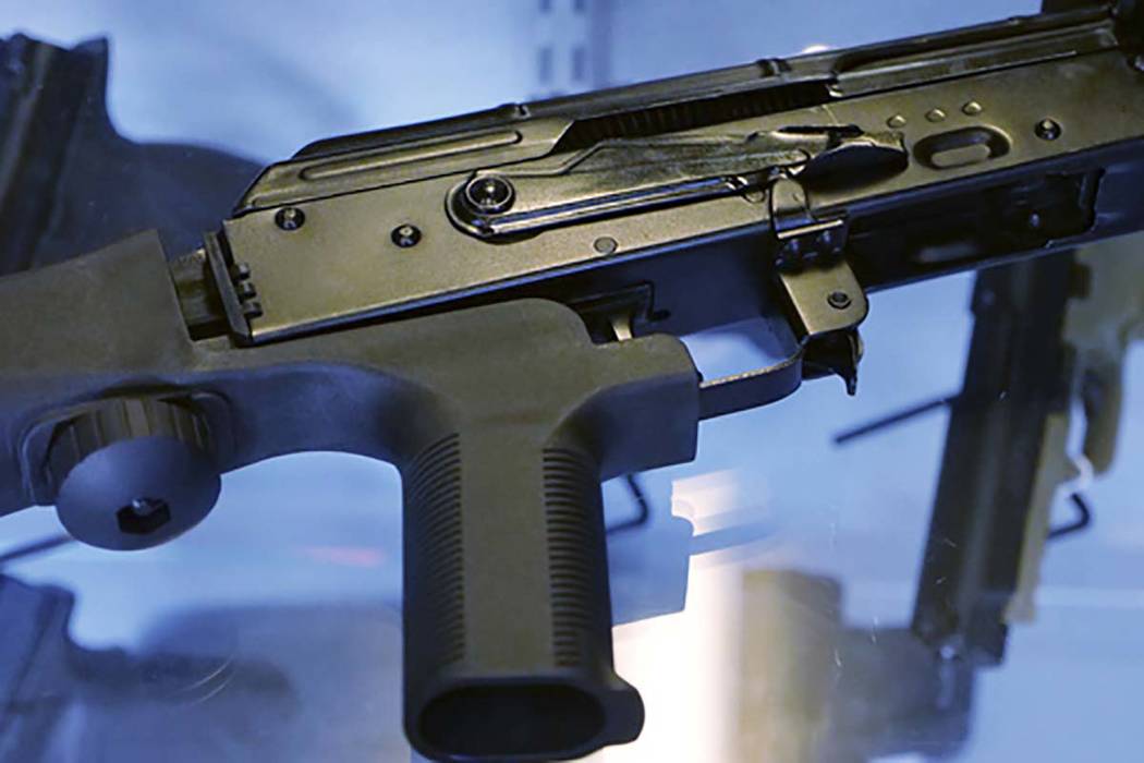 This Oct. 4, 2017 file photo, shows a "bump stock" attached to a semi-automatic rifle at a gun store and shooting range in Utah. (Rick Bowmer/AP File)