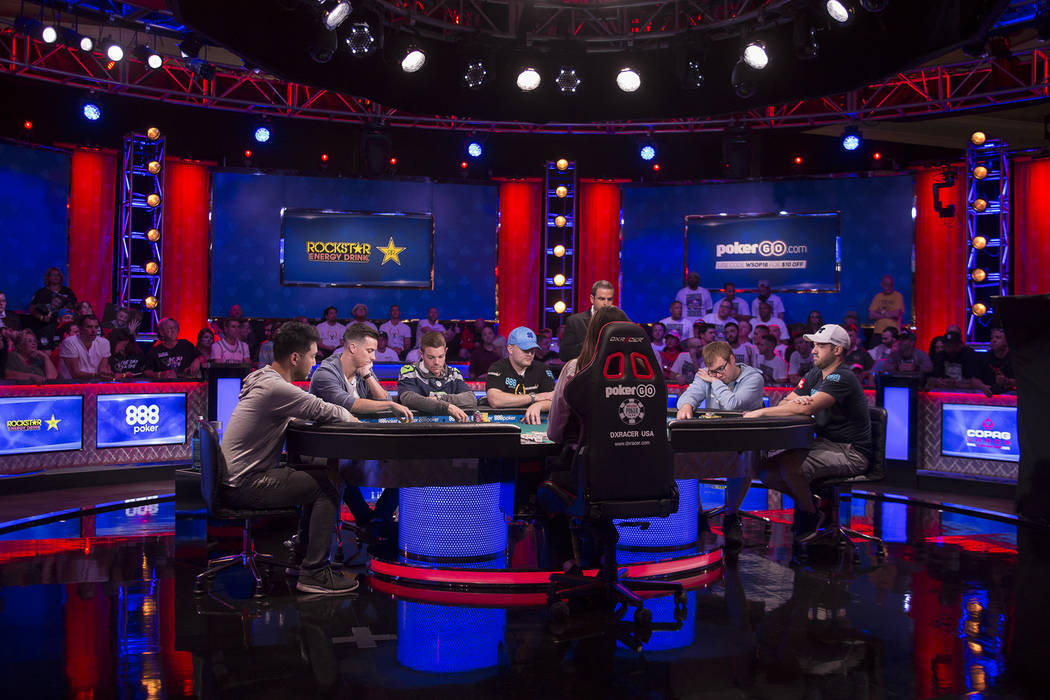 Seven players remain during the eighth day of the World Series of Poker tournament at the Rio Convention Center in Las Vegas, Thursday, July 12, 2018. From left, John Cynn, Alexander Lynskey, Tony ...