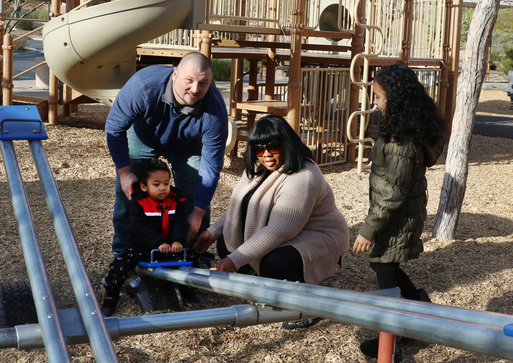 Kevin Pauley and his wife Erica play with their kids Charlie, 2, and Meena, 7, at Exploration Peak Park on Monday, Dec. 24, 2018, in Las Vegas. Bizuayehu Tesfaye Las Vegas Review-Journal @bizutesfaye