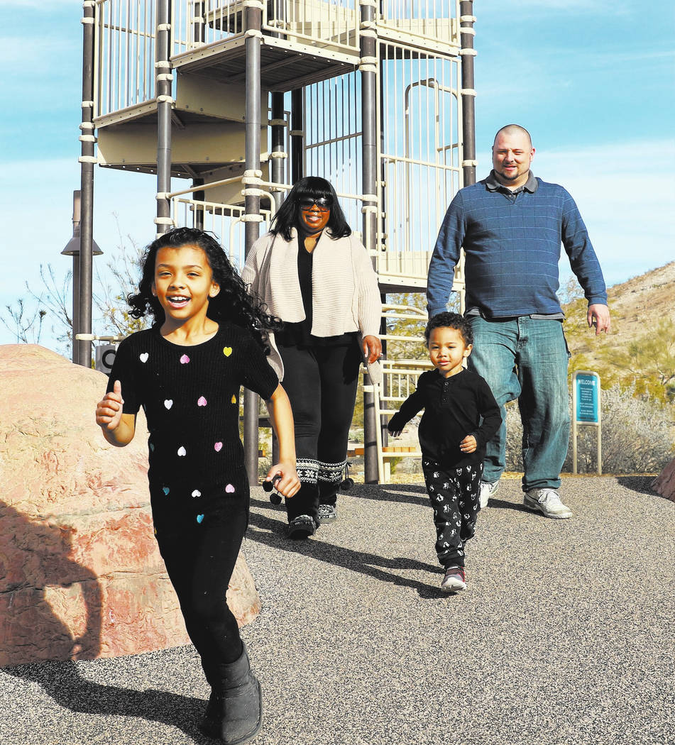 Erica Kyles-Pauley and her husband Kevin play with their kids Charlie, 2, and Meena, 7, at Exploration Peak Park on Monday, Dec. 24, 2018, in Las Vegas. Bizuayehu Tesfaye Las Vegas Review-Journal ...
