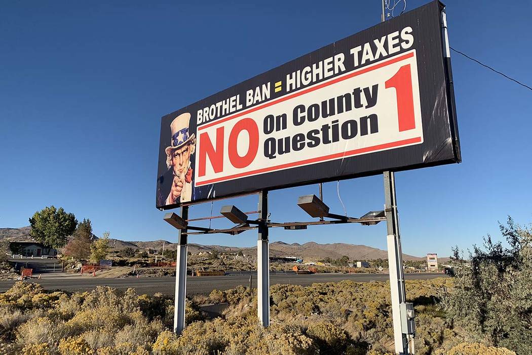 A sign outside the Bunny Ranch restaurant in Mound House, Lyon County, urges passersby to vote against banning legal prostitution in the county. (Bill Dentzer/Las Vegas Review-Journal)