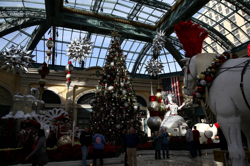 Guests check out the Majestic Holiday Magic at the Bellagio Conservatory & Botanical Gardens in Las Vegas Friday, Dec. 21, 2018. The display will be up through Jan. 6, 2019. K.M. Cannon Las Ve ...