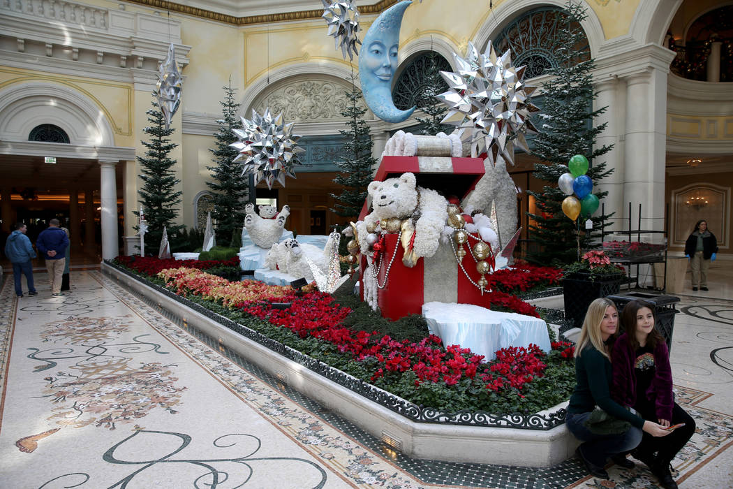 Julie Nideffer and her daughter Stella Vazquez, 8, of Houston at Majestic Holiday Magic at the Bellagio Conservatory & Botanical Gardens in Las Vegas Friday, Dec. 21, 2018. The display will be ...