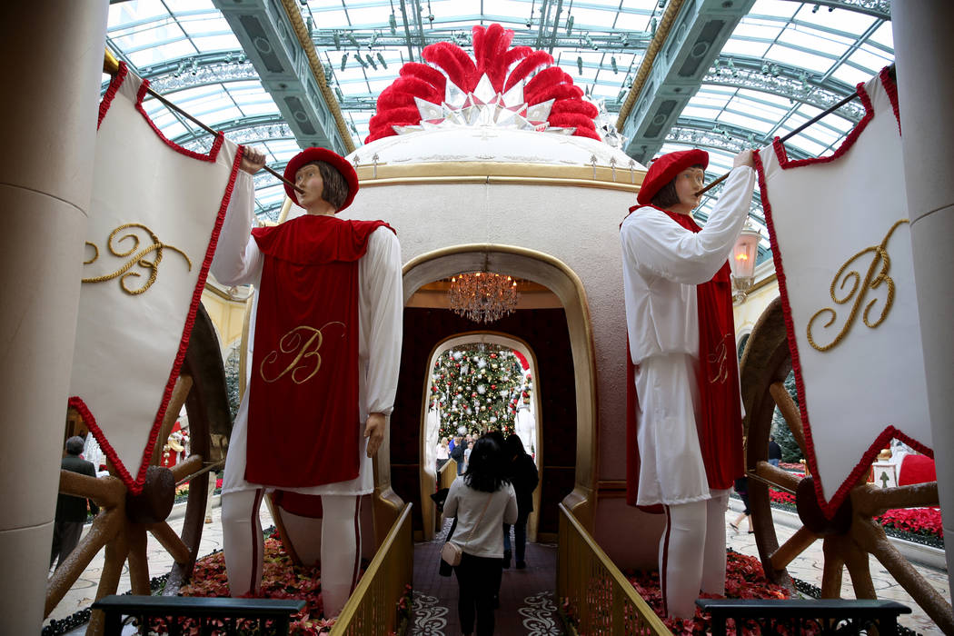 Guests check out the Majestic Holiday Magic at the Bellagio Conservatory & Botanical Gardens in Las Vegas Friday, Dec. 21, 2018. The display will be up through Jan. 6, 2019. K.M. Cannon Las Ve ...