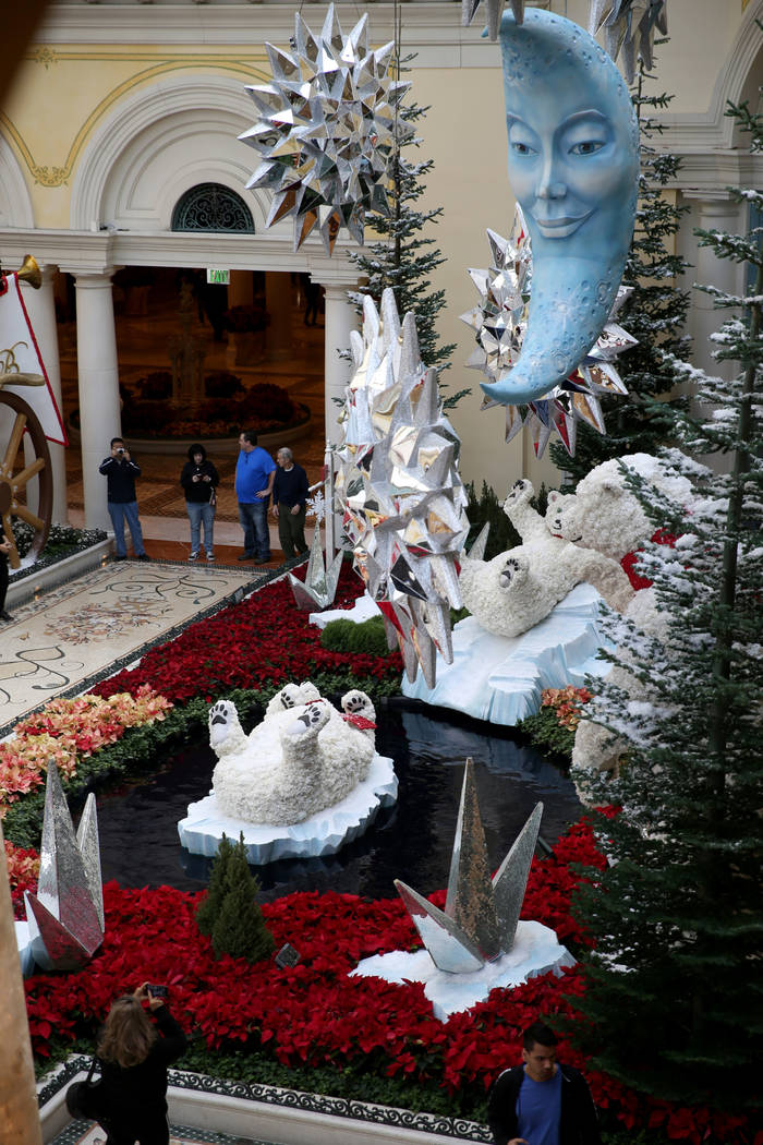 Guests check out the Majestic Holiday Magic at the Bellagio Conservatory & Botanical Gardens in Las Vegas Friday, Dec. 21, 2018. The display will be up through Jan. 6, 2019. K.M. Cannon Las Ve ...