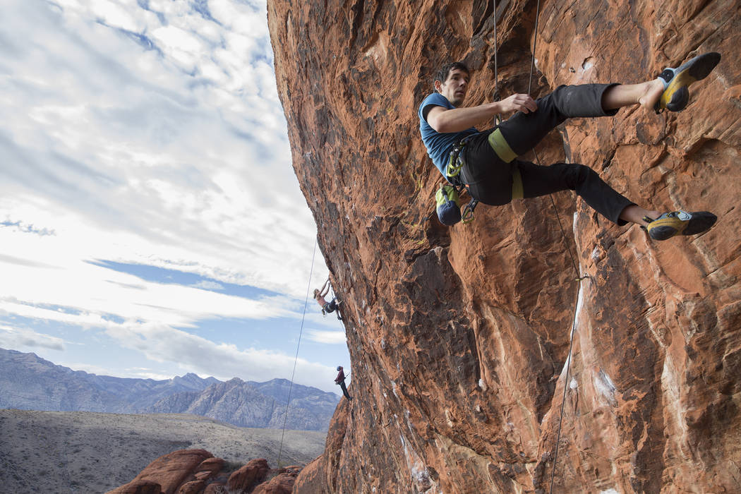 Alex Honnold descends The Gallery at Red Rock Canyon on Monday, Dec. 17, 2018, in Las Vegas. Honnold, arguably the best rock climber in the world, solo climbed El Capitan, a 3,000-foot granite wal ...