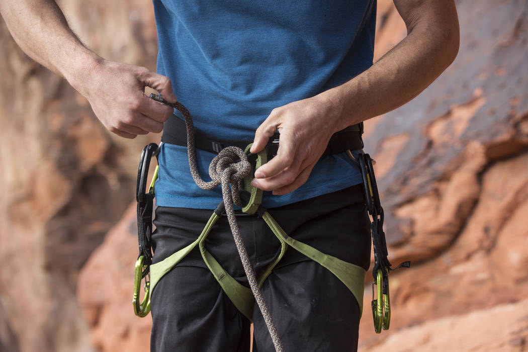 Alex Honnold prepares his gear to climb The Gallery at Red Rock Canyon on Monday, Dec. 17, 2018, in Las Vegas. Honnold, arguably the best rock climber in the world, solo climbed El Capitan, a 3,00 ...