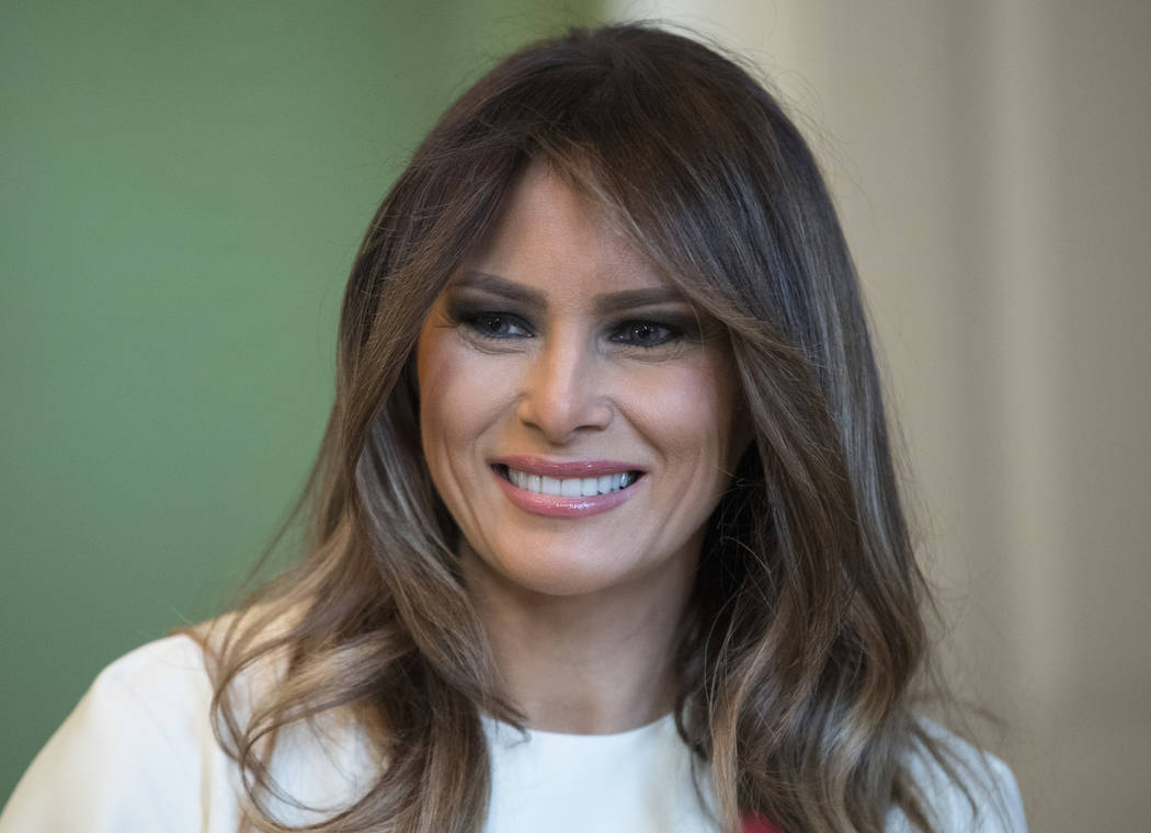 In this Monday, Nov. 27, 2017 file photo, First lady Melania Trump smiles as she visits with children in the East Room of the White House in Washington. (AP Photo/Carolyn Kaster, File)