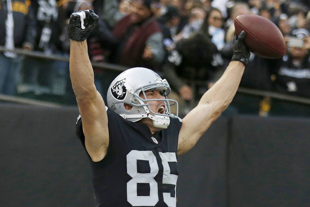 Oakland Raiders tight end Derek Carrier (85) celebrates after scoring against the Pittsburgh Steelers during the second half of an NFL football game in Oakland, Calif., Sunday, Dec. 9, 2018. (AP P ...
