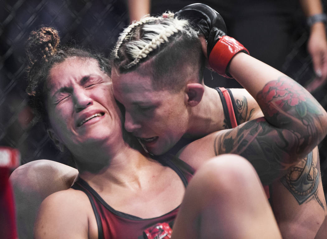 Pannie Kianzad, left, is comforted by Macy Chiasson after Chiasson submitted her in the second round of “The Ultimate Fighter” Season 28 Finale on Friday, Nov. 30, 2018, at The Pearl ...