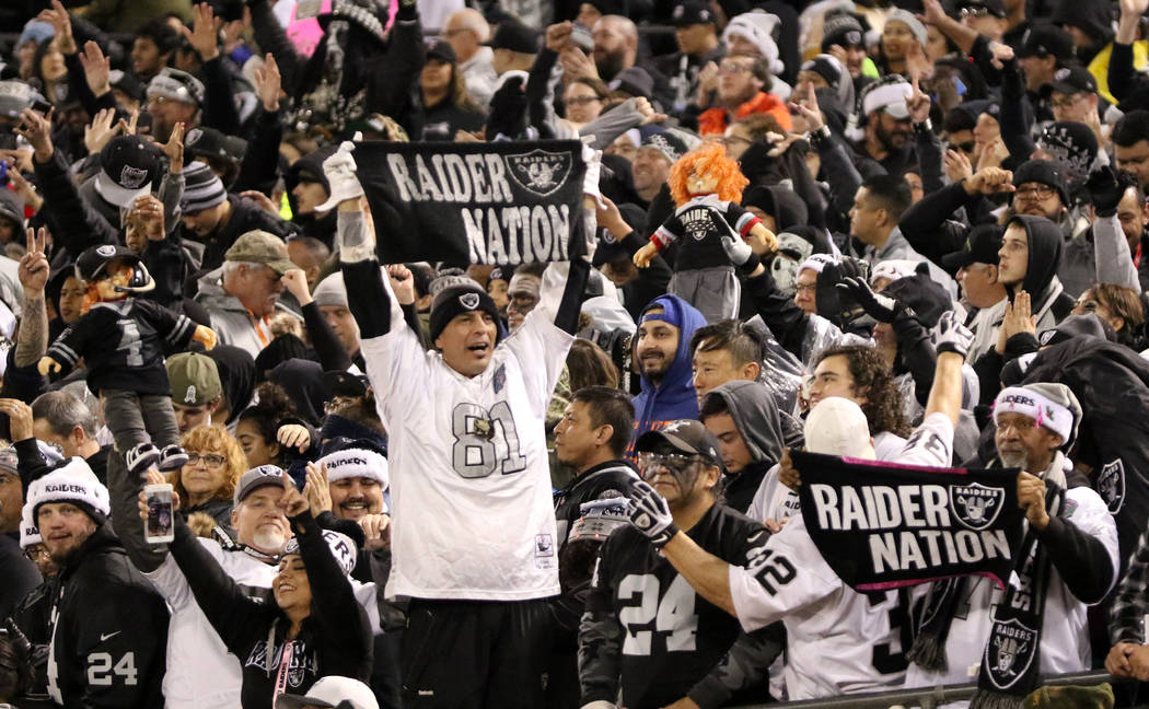 Oakland Raiders fans hold up dolls and towels during the first half of an NFL game against the Denver Broncos in Oakland, Calif., Monday, Dec. 24, 2018. Heidi Fang Las Vegas Review-Journal @HeidiFang