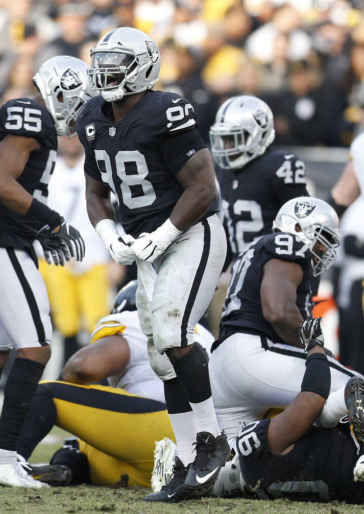 Oakland Raiders defensive tackle Frostee Rucker (98) reacts during an NFL football game against the Pittsburgh Steelers in Oakland, Calif., Sunday, Dec. 9, 2018. (AP Photo/D. Ross Cameron)