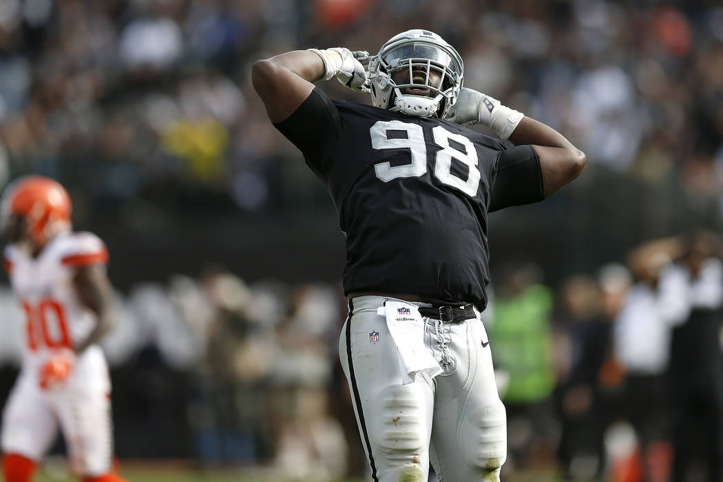 Oakland Raiders defensive tackle Frostee Rucker (98) celebrates during the second half of an NFL football game against the Cleveland Browns in Oakland, Calif., Sunday, Sept. 30, 2018. (AP Photo/D. ...