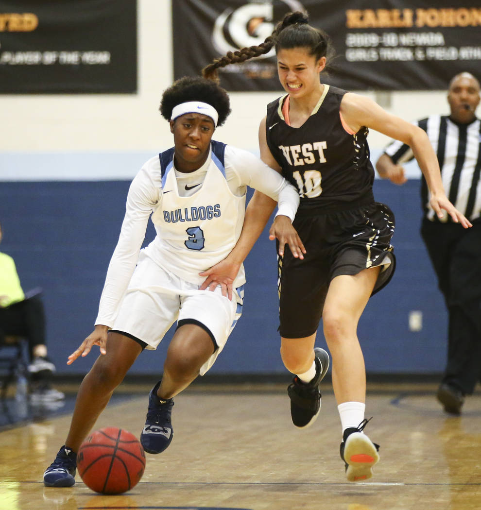 CentennialÕs Quinece Hatcher (3) drives the ball under pressure from WestÕs Christina Swenson (10) during a basketball game at Centennial High School in Las Vegas on Saturday, Dec. 29, 2 ...