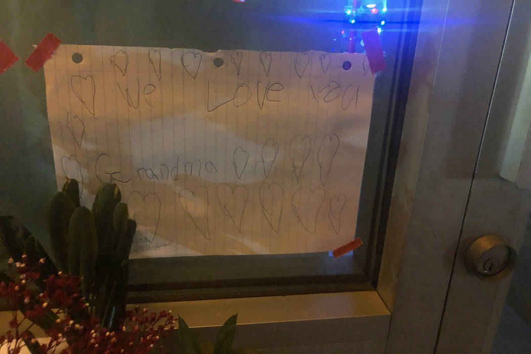 A letter to Nhu Nguyen from her grandchild is taped to the store front of Crystal Nails & Spa in Las Vegas as part of a makeshift memorial on Sunday, Dec. 30, 2018. Nguyen was killed a day prior o ...