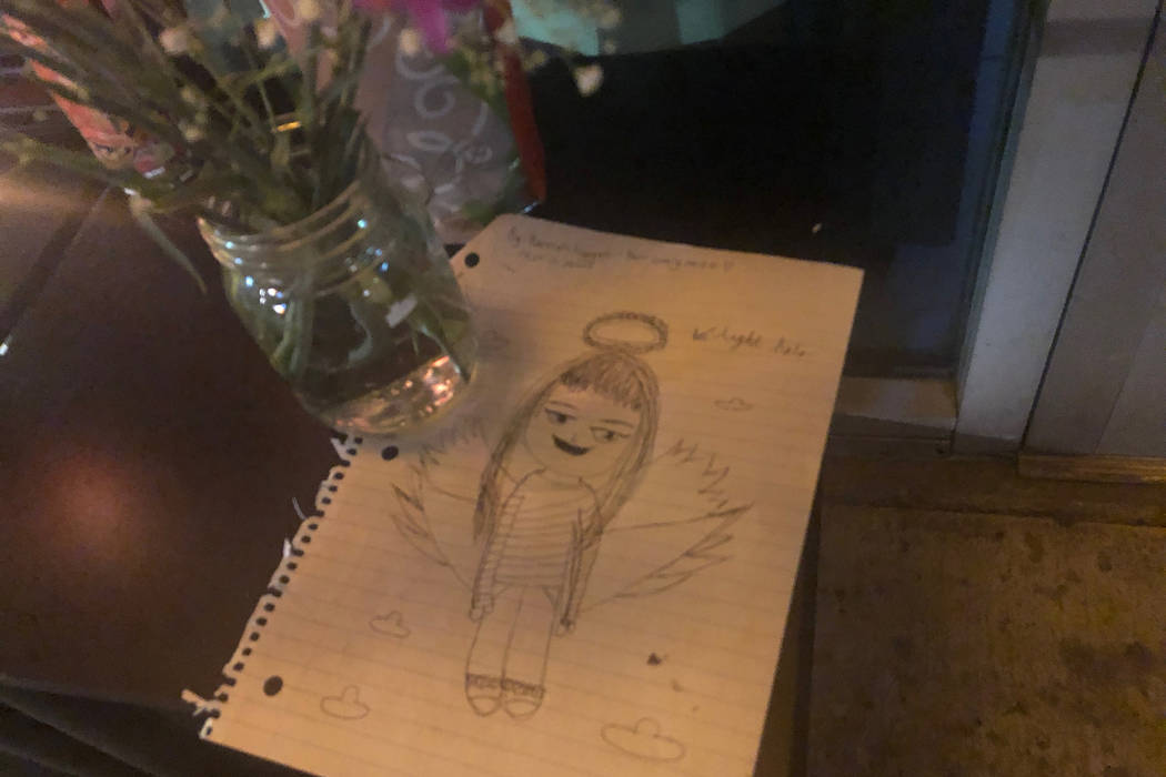 A drawing of Nhu Nguyen as an angel made by her niece is seen in front Crystal Nails & Spa in Las Vegas as part of a makeshift memorial on Sunday, Dec. 30, 2018. Nguyen was killed a day prior outs ...