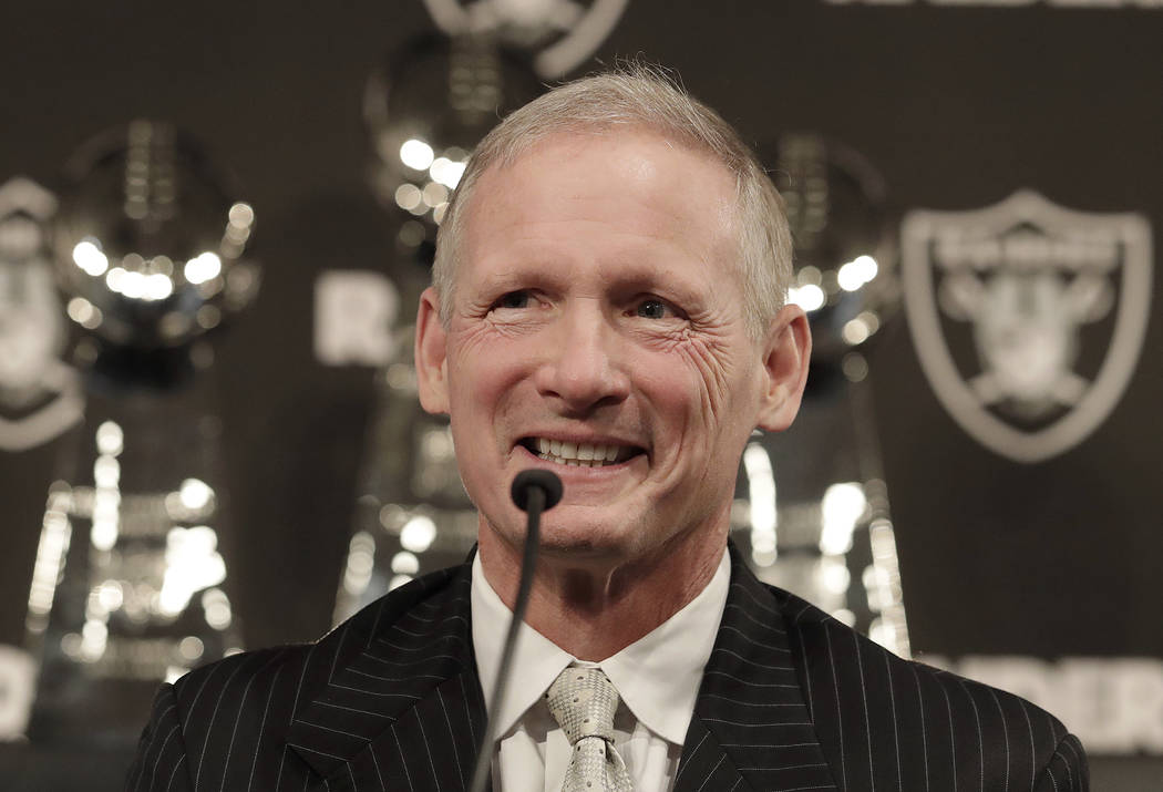 Mike Mayock smiles as at a news conference where he was introduced as the new Oakland Raiders general manager at the team's headquarters in Oakland, Calif., Monday, Dec. 31, 2018. (AP Photo/Jeff Chiu)