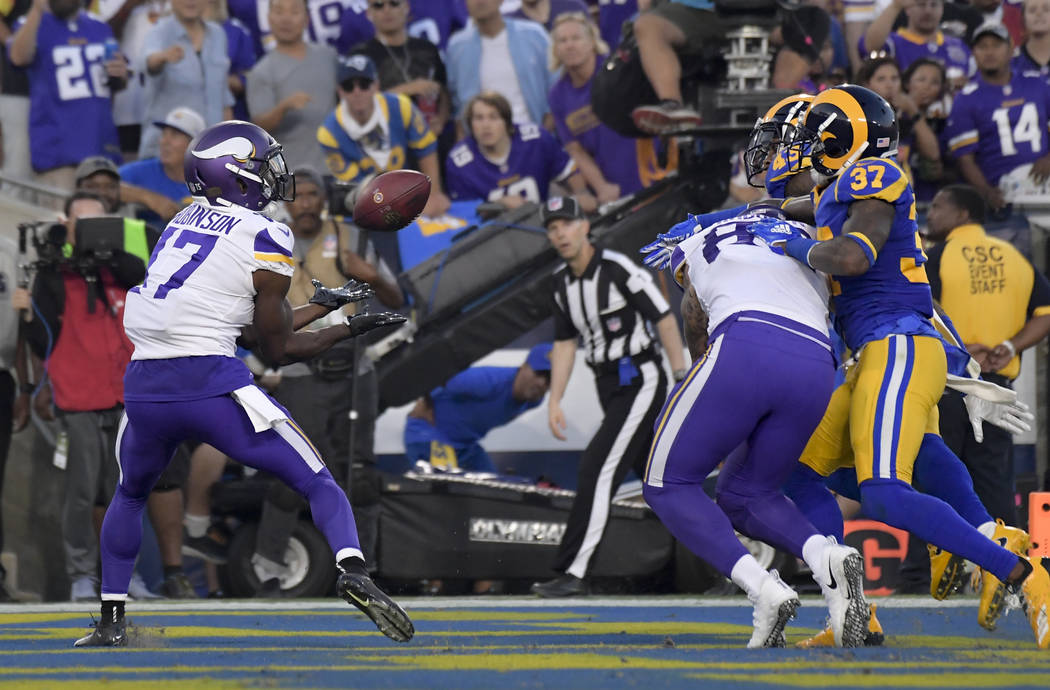 Minnesota Vikings wide receiver Aldrick Robinson, left, scores against the Los Angeles Rams during the first half in an NFL football game Thursday, Sept. 27, 2018, in Los Angeles. (AP Photo/Mark J ...