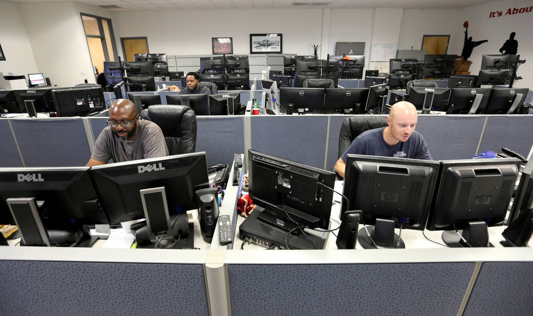 Don Best Sports analysts, from left, Andre Burks, Marvin Holiday and Aaron Burns trade games in their Las Vegas office Thursday, Sept. 27, 2018. K.M. Cannon Las Vegas Review-Journal @KMCannonPhoto