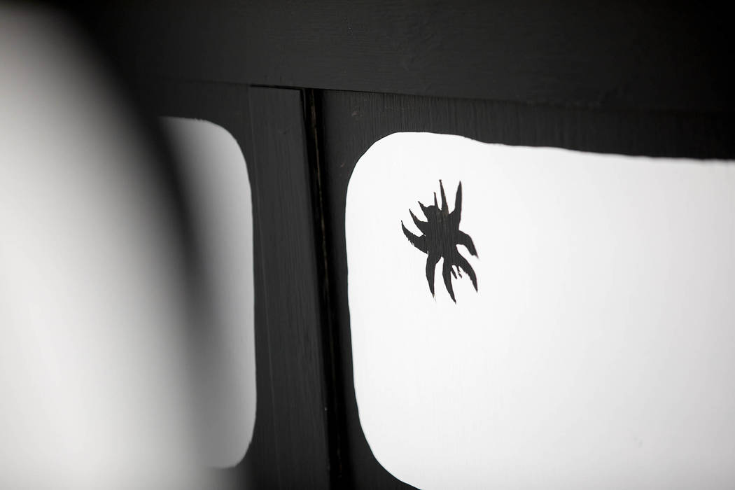 Artist Joshua Vides includes a bug on many of his immersive monochromatic rooms. Clint Jenkins