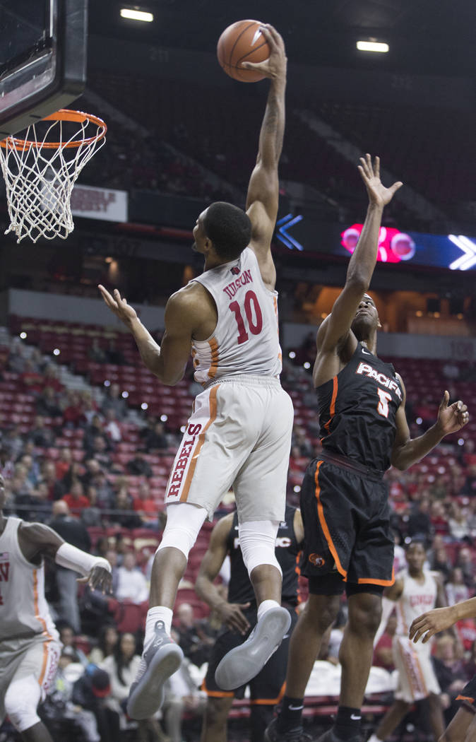 UNLV senior forward Shakur Juiston (10) elevates for a dunk over Pacific senior forward Anthony Townes (5) in the first half on Tuesday, Nov. 20, 2018, at the Thomas & Mack Center, in Las Vega ...