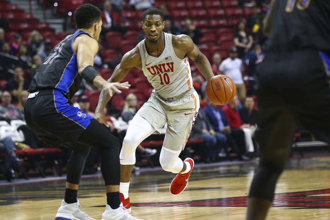 UNLV Rebels forward Shakur Juiston (10) brings the ball up court as UC Riverside Highlanders forward Zac Watson (11) defends during the first half of a basketball game at the Thomas & Mack Cen ...