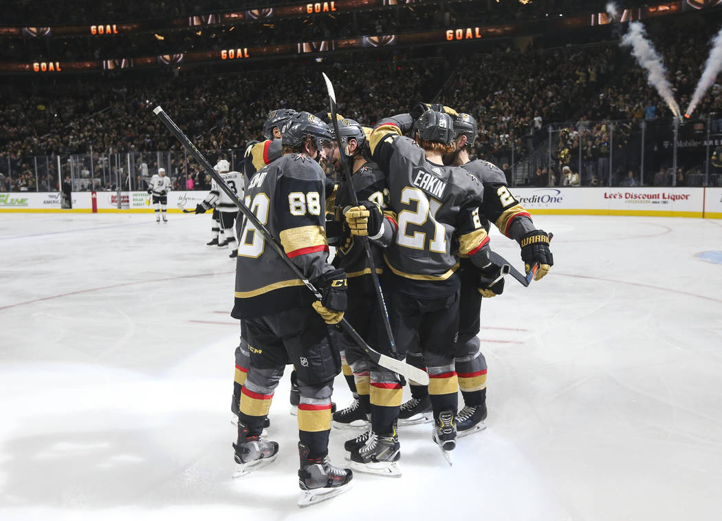 Golden Knights players celebrate a goal by Vegas Golden Knights center Brandon Pirri during the third period of an NHL hockey game against the Los Angeles Kings at T-Mobile Arena in Las Vegas on T ...