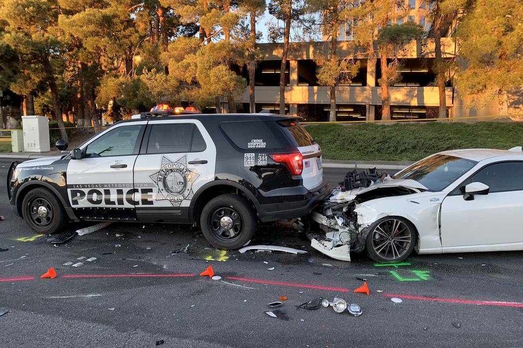 A suspected DUI driver crashed into a Las Vegas police motorcycle and police SUV, injuring one officer, on Paradise Road near Corporate Drive, Tuesday, Jan. 1, 2019. (Twitter/Las Vegas Metropolita ...