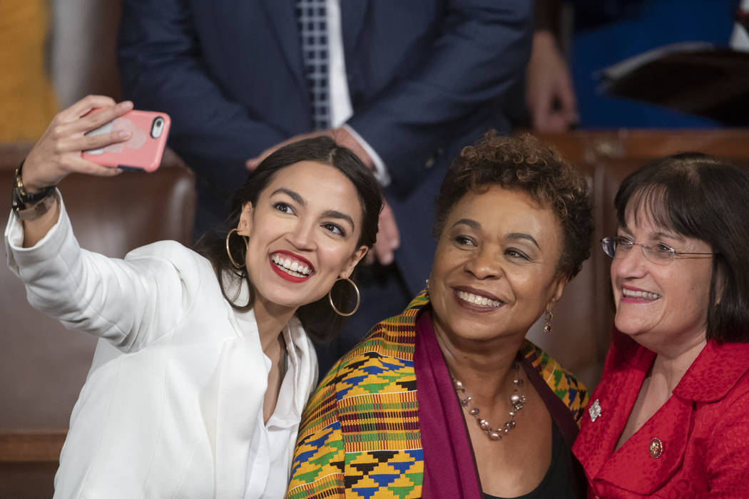 Rep.-elect Alexandria Ocasio-Cortez, a freshman Democrat representing New York's 14th Congressional District, takes a selfie with Rep. Ann McLane Kuster, D-NH, and Rep. Barbara Lee, D-Calif., on t ...